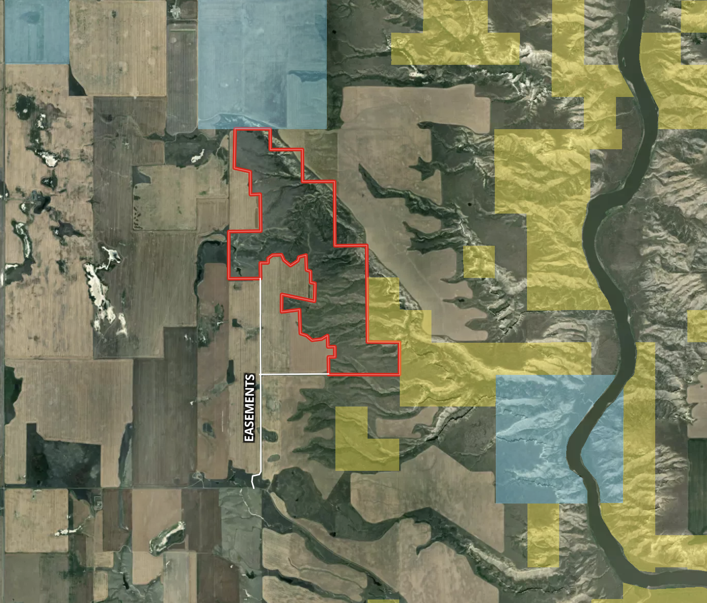 Aerial map with farm fields, irregular red boundary, labeled “Easements,” and yellow and blue shaded areas. A winding river appears on the right side.